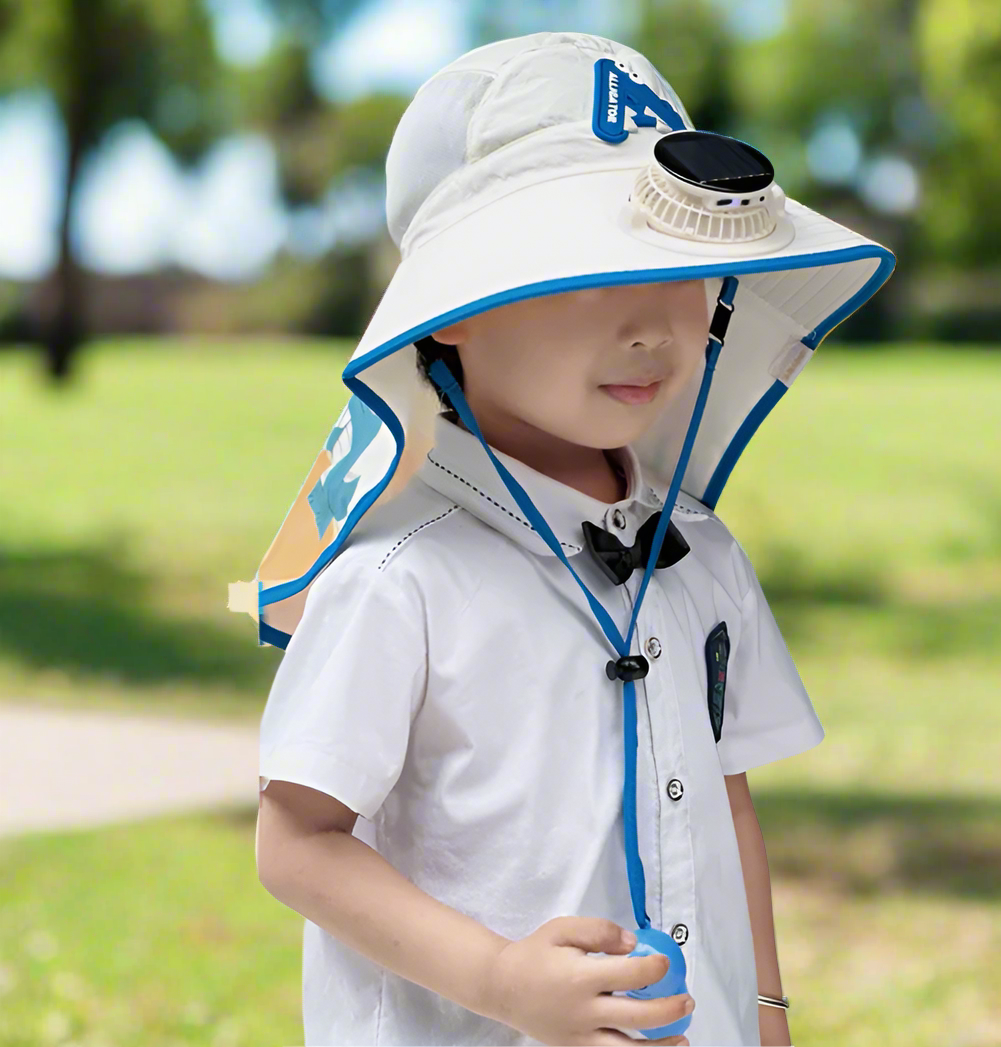 Child wearing a white sun hat with solar fan